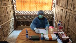 A doctor being supported by Christian Aid in the Rohingya refugee camps in Cox's Bazar, Bangladesh, waits for his next patient